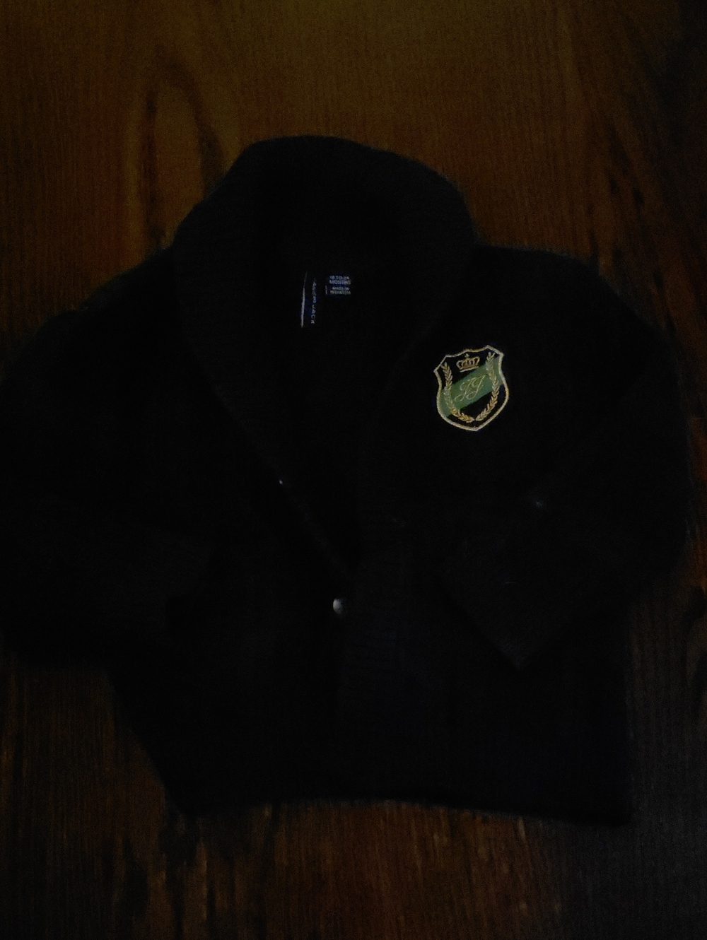 Janie and Jack Black Shawl Collar Cardigan with Crest Patch